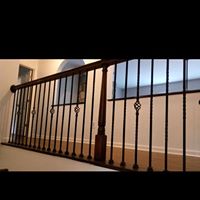 Iron railing with wooden balusters